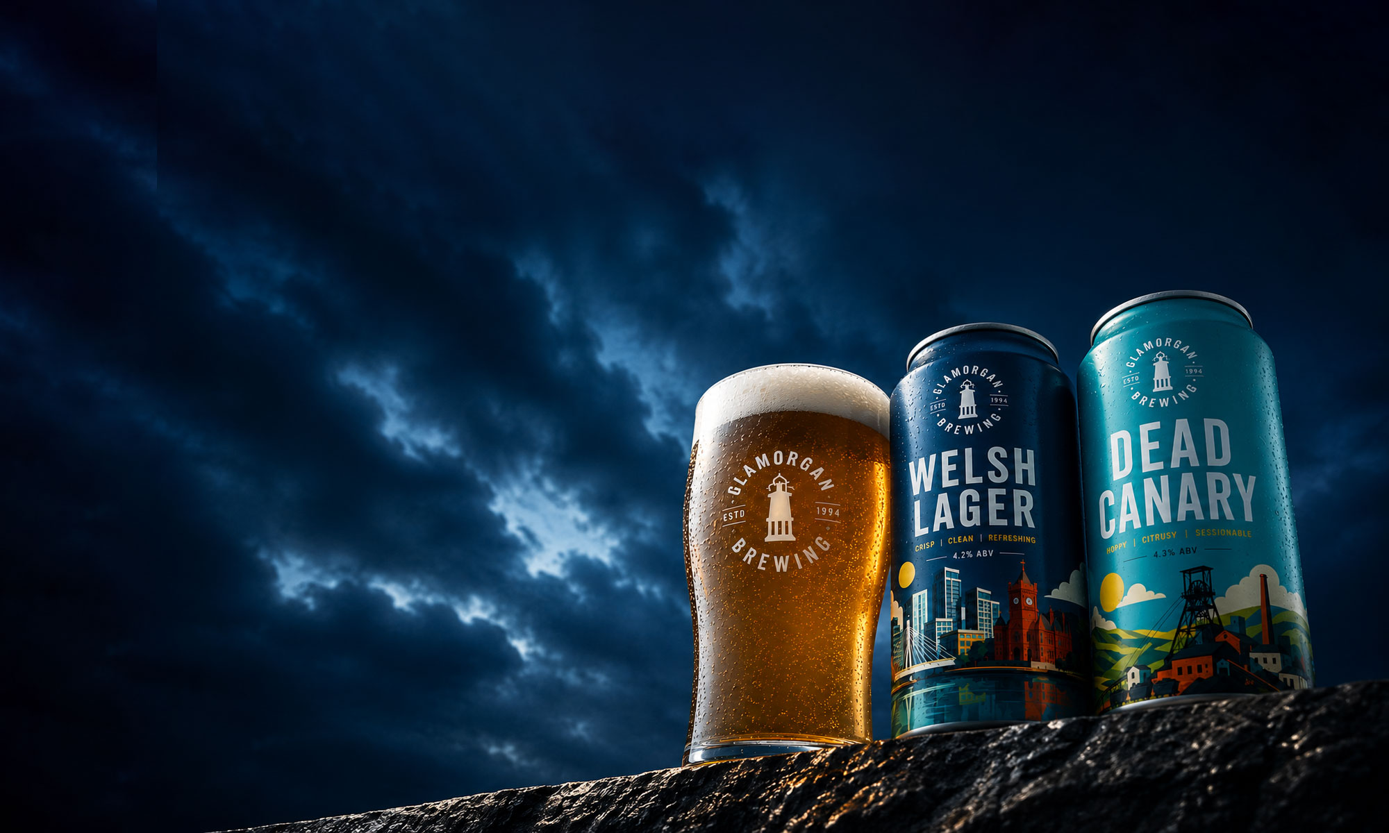 Welsh Lager and Dead Canary cans beside a freshly poured pint